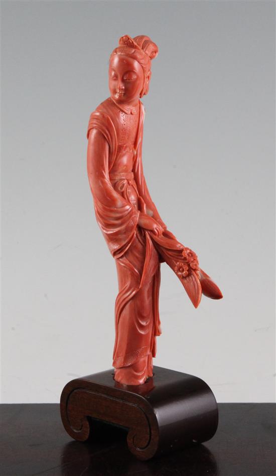 A Chinese coral figure of a beautiful lady, 20cm incl. wood stand